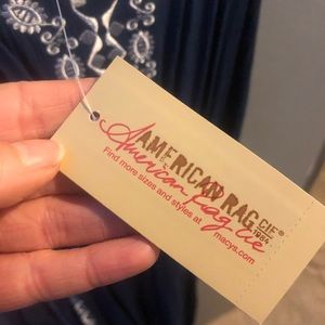 Navy blue wide leg romper with white embroidery